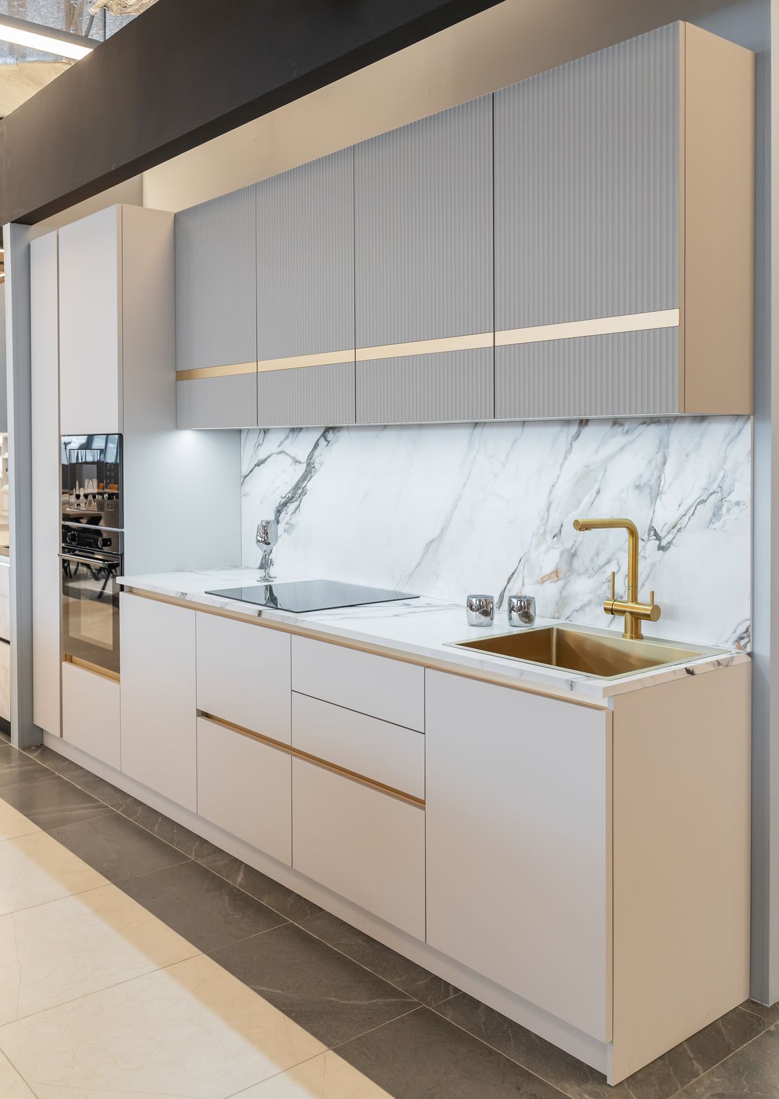 White and gray kitchen cabinets with marble backsplash refinished by Shark Painting in Lakewood Ranch, FL
