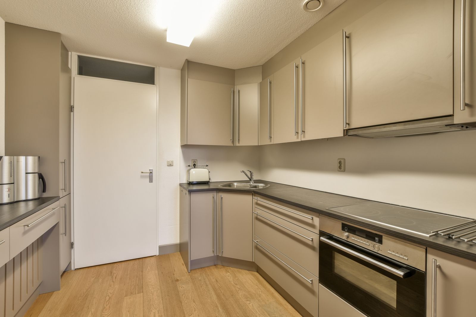 White cabinet painting with stainless steel appliances in Lakewood Ranch